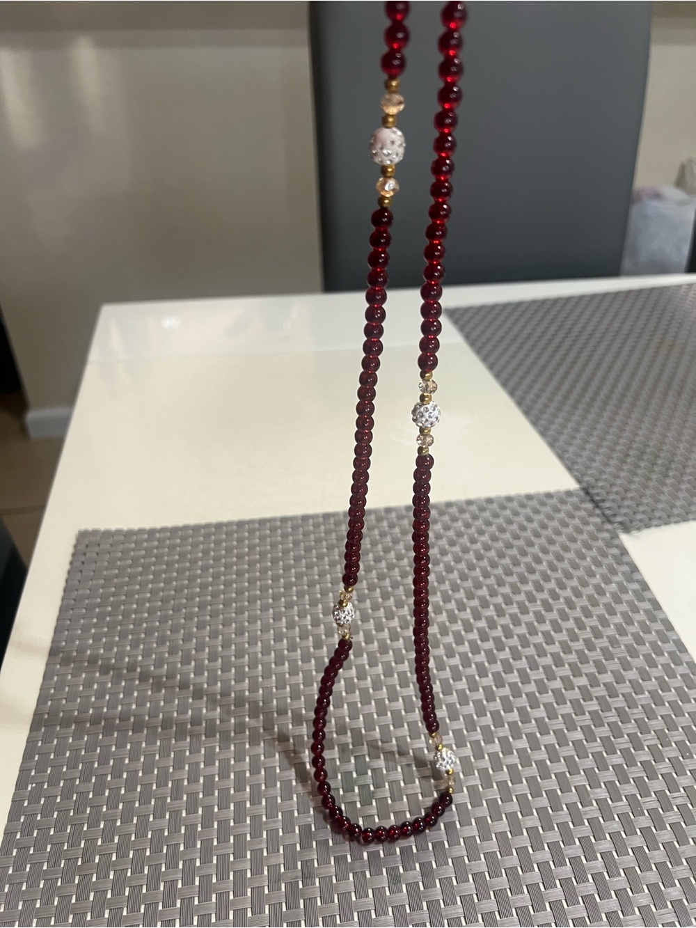 Elegant Burgundy Beaded Necklace with Gold and White Accents
